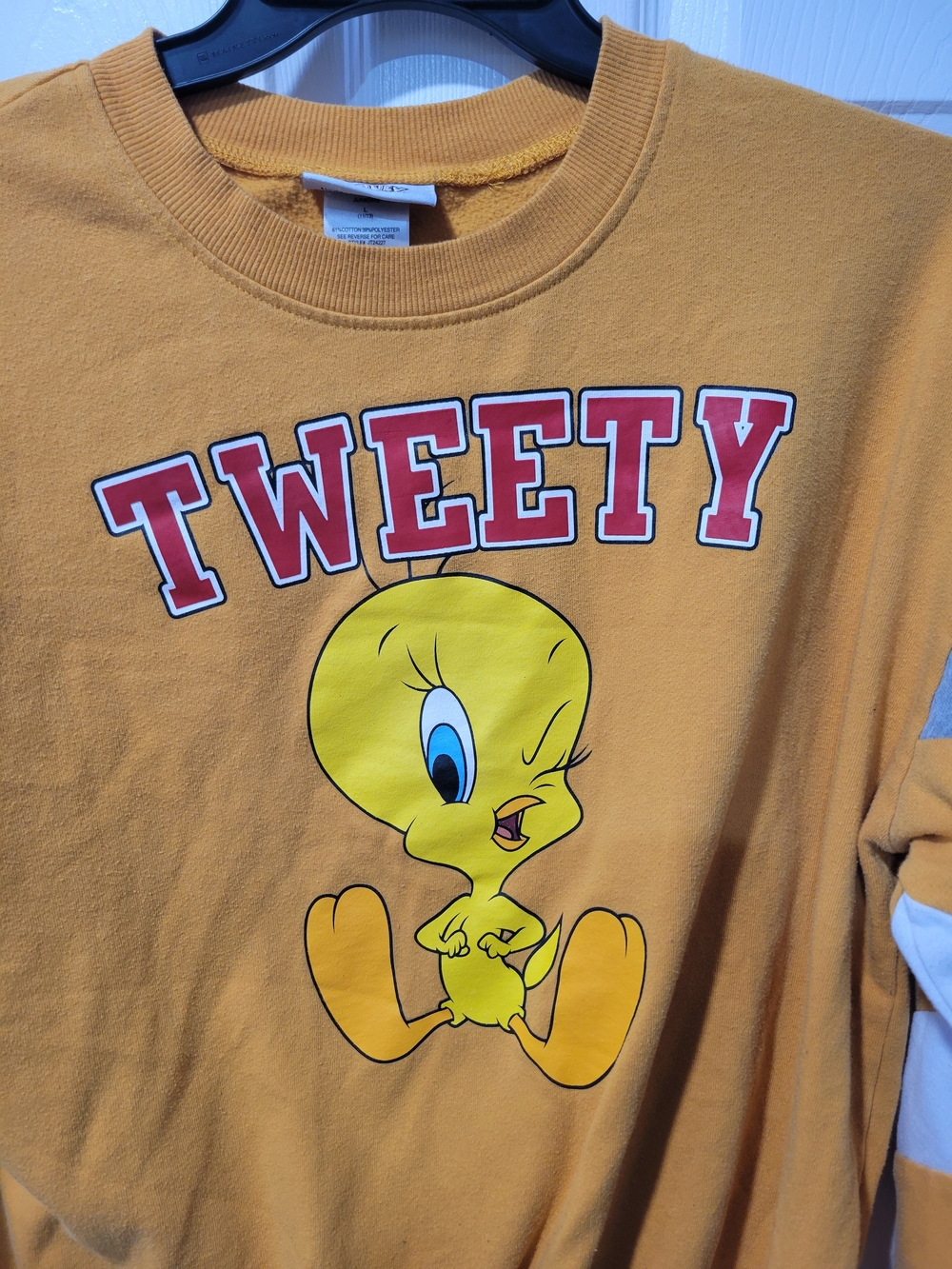 Warner Bros. Tweety Graphic Crewneck in Mustard Yellow with Red Lettering